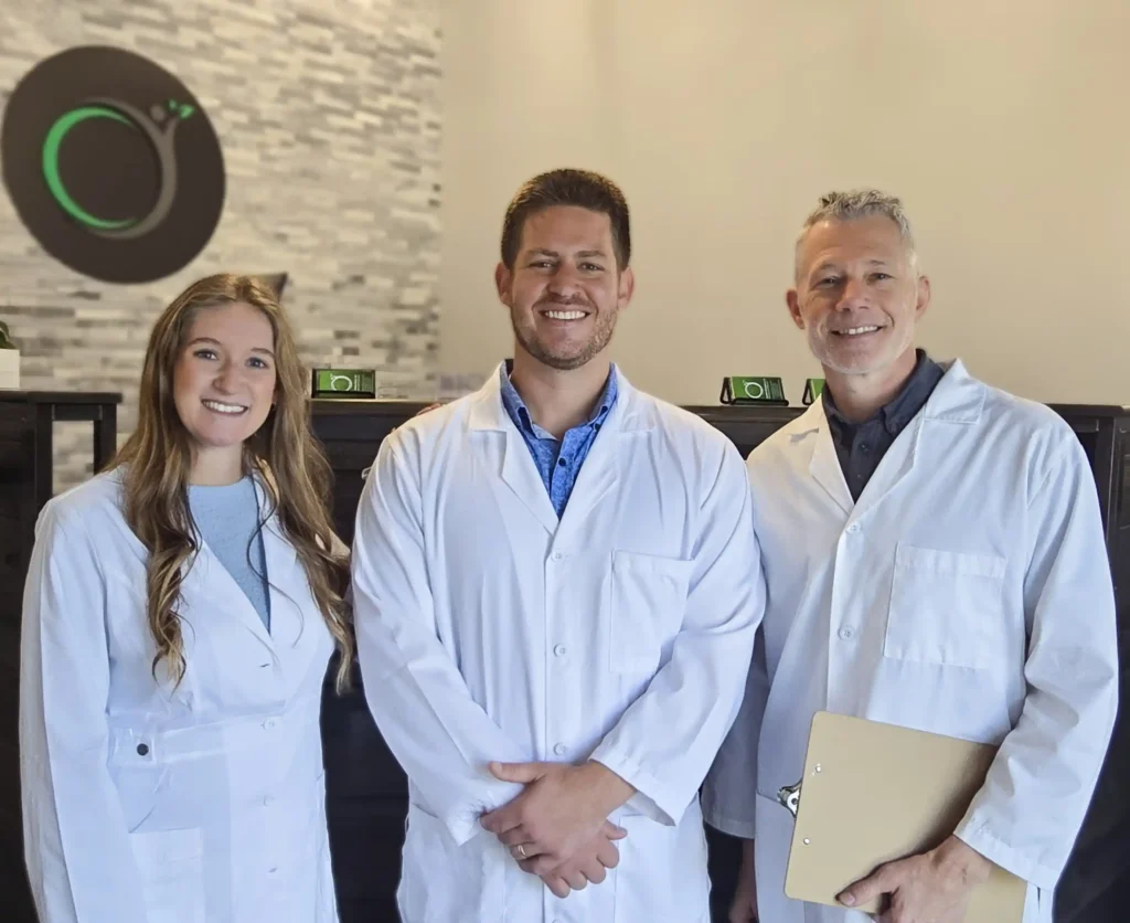 Chiro Life Wellness chiropractic doctors team standing together in clinic reception area.